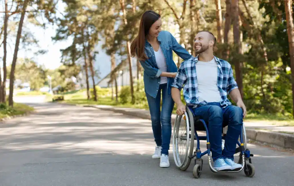 disabled-man-walking-with-wife-1030×651