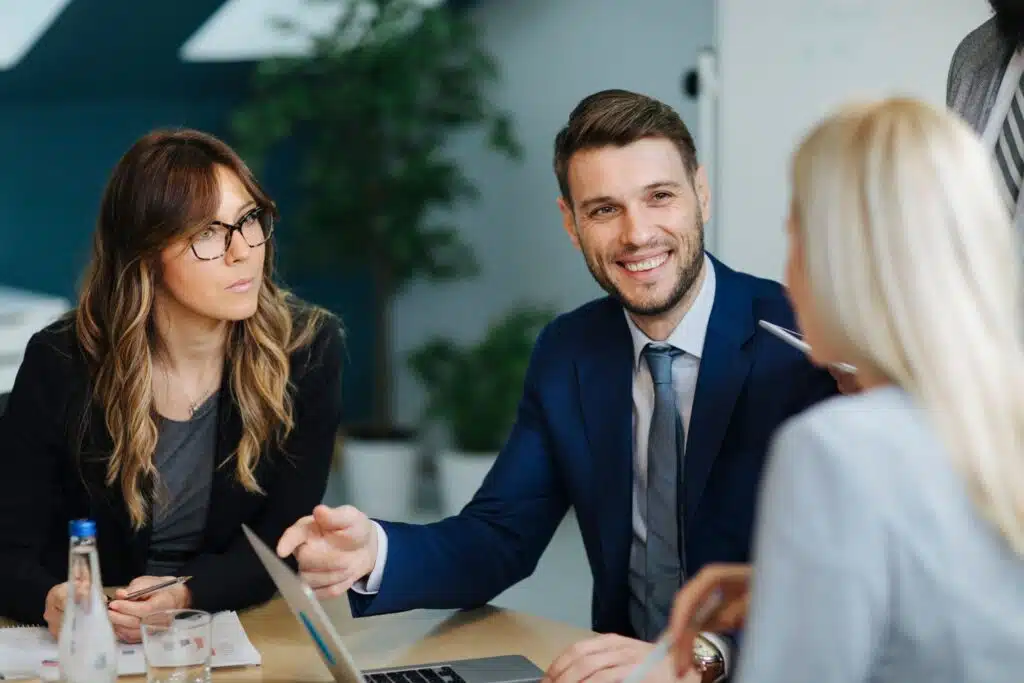 3 people discussing insurance